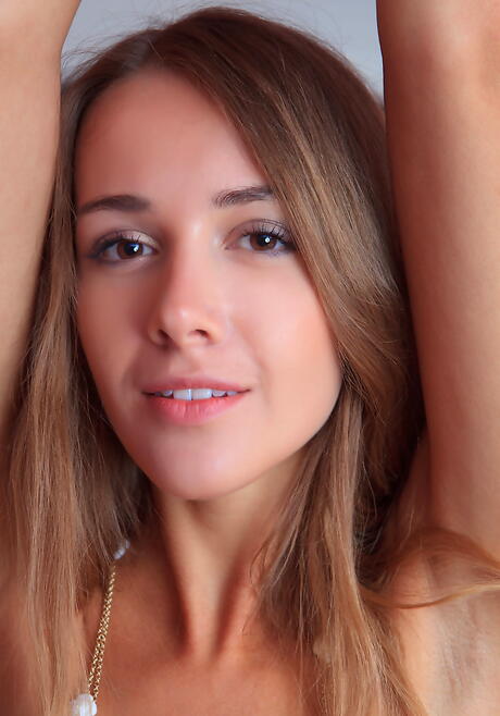 Slender blonde teen Lina Diamond uncovering tiny tits and sexy ass 